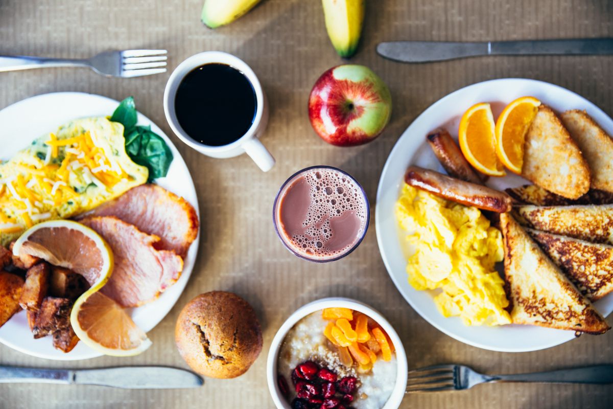 A plain wooden kitchen table — the editorial setting for day-to-day strategy notes in this review